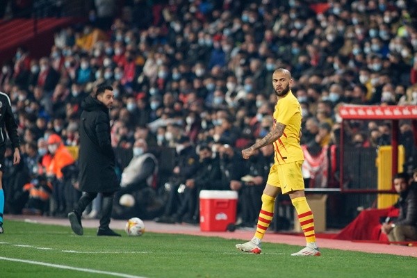 FC Barcelona coach Xavi Hernandez (L) and Daniel Alves (R)...